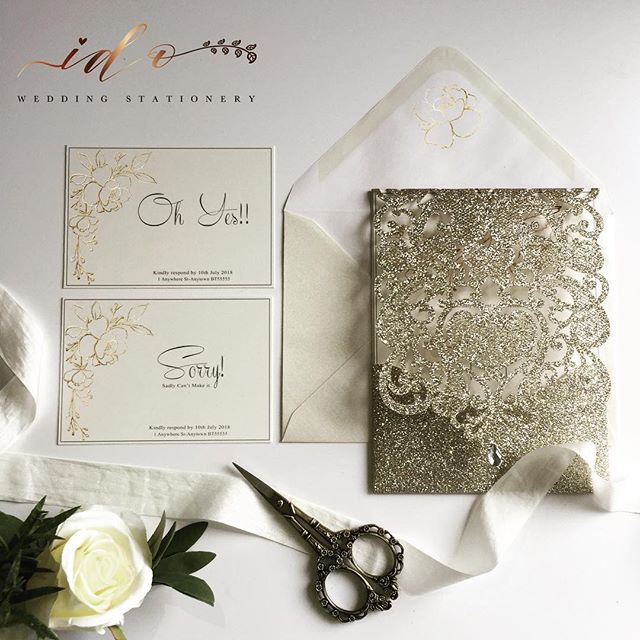 Champagne gold laser cut folder, with gold foil floral details printed on ivory card. A beautifully formal and elegant Wedding Invitation for your guests-online